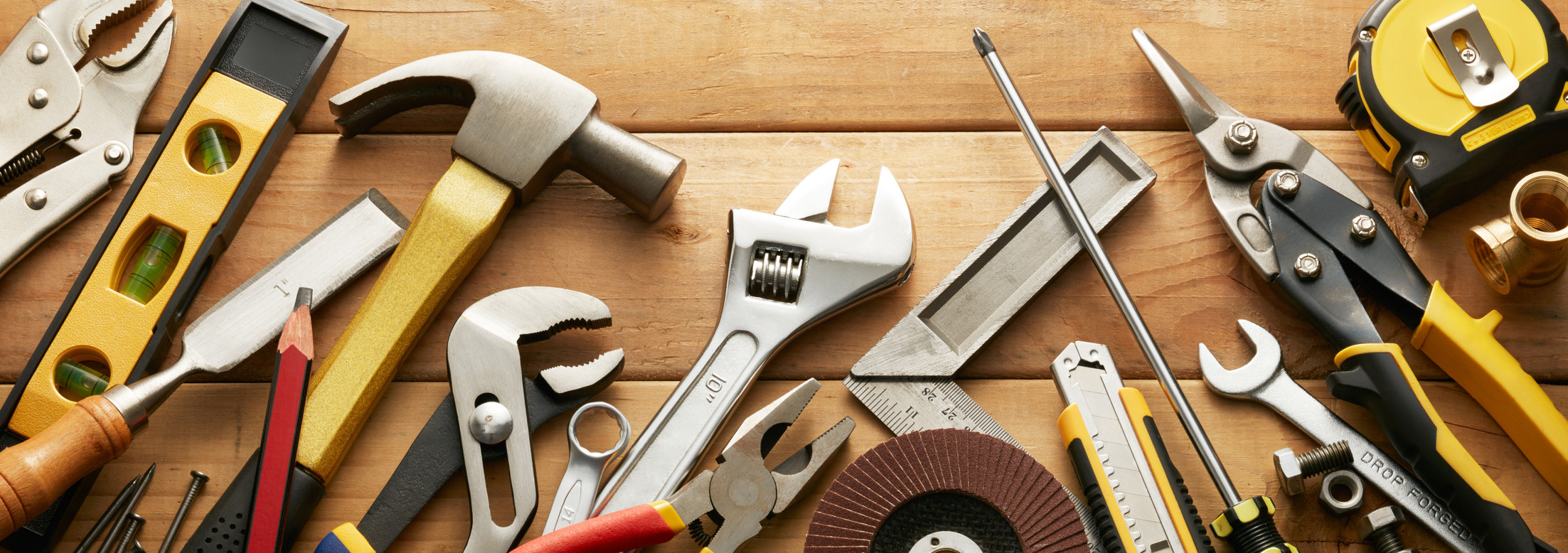 variety of tools on wood planks with copy space